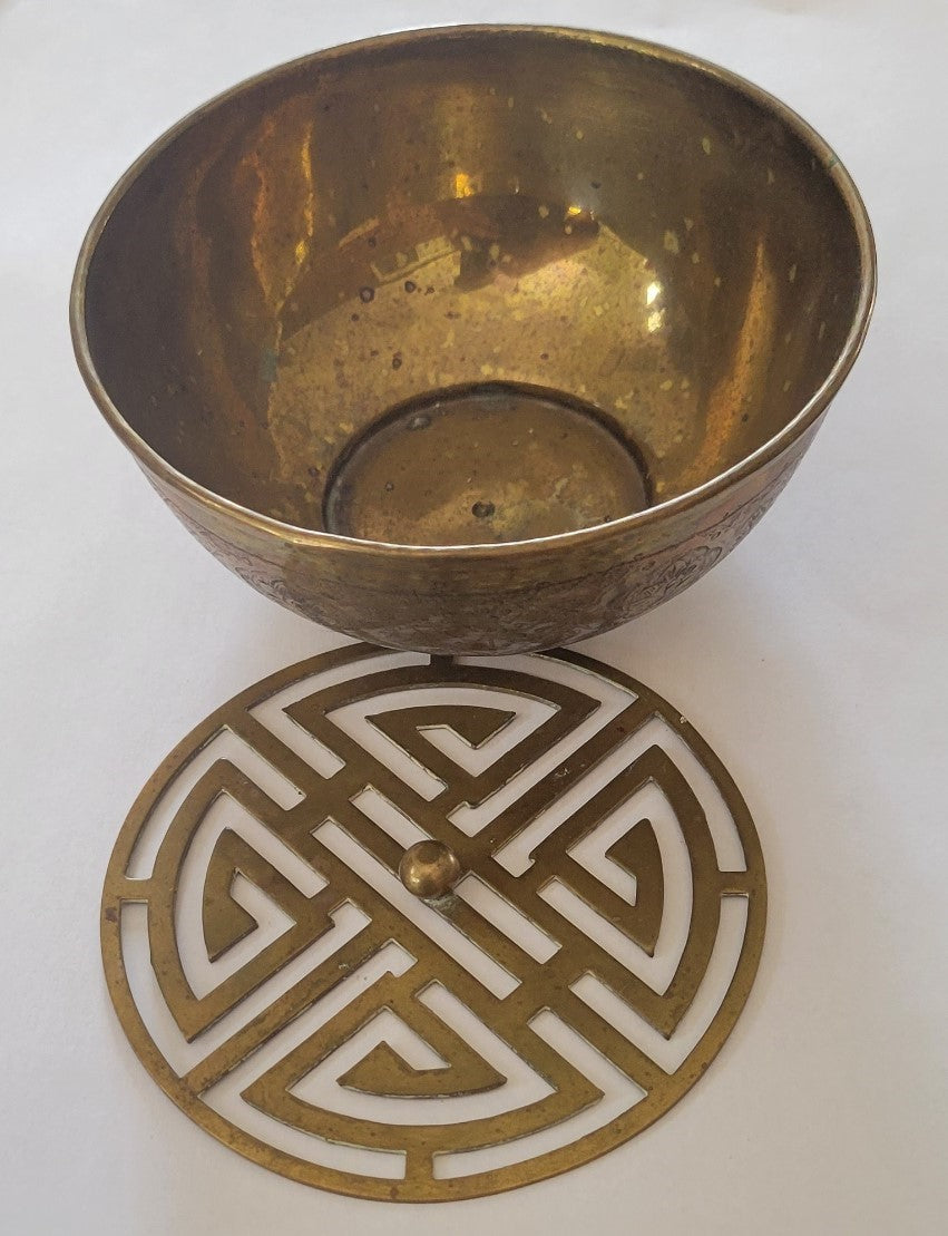 Vintage brass incense bowl with insert and engravings, top view with removed insert.