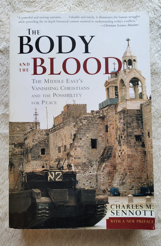 Used book for sale "The Body and the Blood: The Middle East's Vanishing Christians and the Possibility for Peace" by Charles M. Sennott, published in 2003 by PublicAffairs, a member of the Perseus Books Group. Front cover.