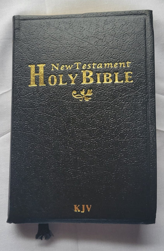 Used book for sale, Pocket size, red letter, King James Version New Testament. Front view.